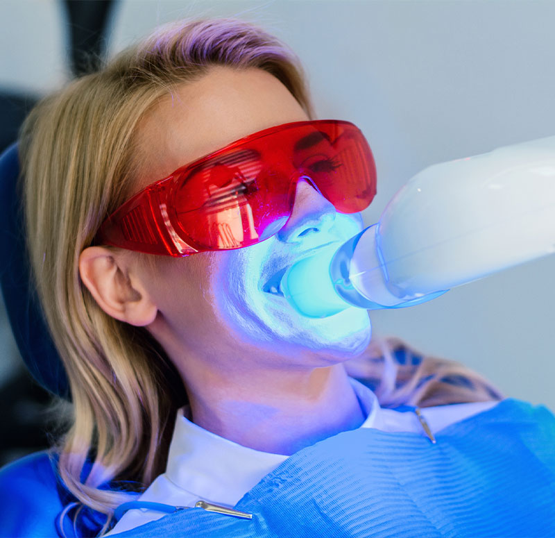 Patient receiving teeth whitening